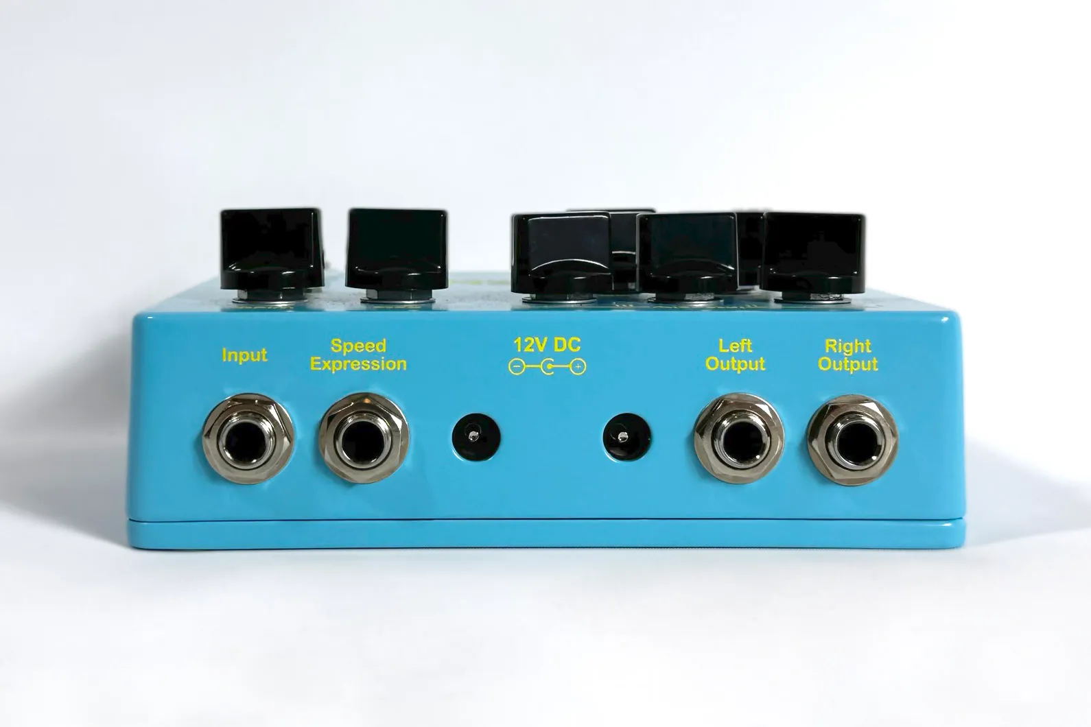 Front view of a light blue The Last Ménage Threeway stereo chorus pedal.
